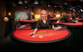 Live dealer at Red Tiger table on alay4d slot, showing cards and betting area